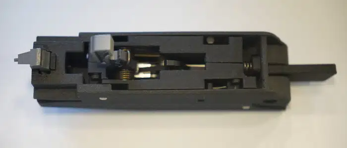Close-up of a Titus Arms AR-15 fire-control-group conversion component